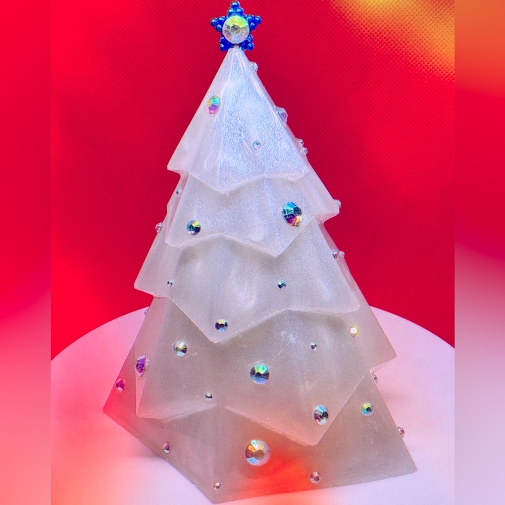 Solid resin tree decorated with rhinestones.